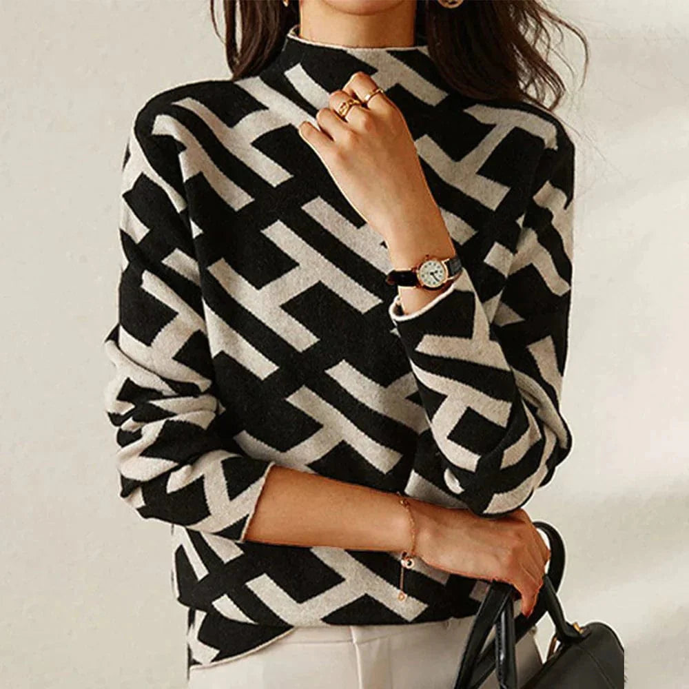 Eleganter Damenpullover mit geometrischem Muster, schwarz-weiß, ideal für stilvolle Herbst- und Wintermode. Perfekt für modische Outfits.