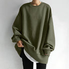 Übergroßer olivgrüner Pullover für Damen, modisch und bequem, ideal für lässige Outfits. Perfekt für Herbstmode und Streetwear-Trends.