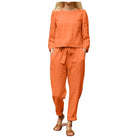 Zweiteiliges Leinen-Ensemble in Orange, bestehend aus lockerem Oberteil und Hose. Perfekt für lässige Sommermode und bequeme Freizeitkleidung.