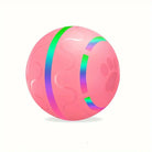 Rosa Hundespielzeugball mit Pfotenabdruck, glänzende Streifen, robustes Gummimaterial.