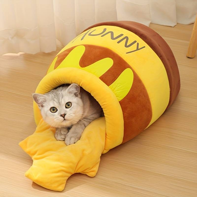 Kuscheliges Katzenbett in Honigtopf-Design, ideal für Haustiere. Weiches, gelbes Plüschmaterial bietet Komfort und Wärme. Perfekt für Katzenliebhaber.