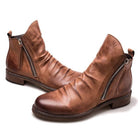 Hochwertige braune Lederstiefel mit seitlichem Reißverschluss, ideal für Herrenmode. Perfekt für stilvolle Herbst- und Winteroutfits.