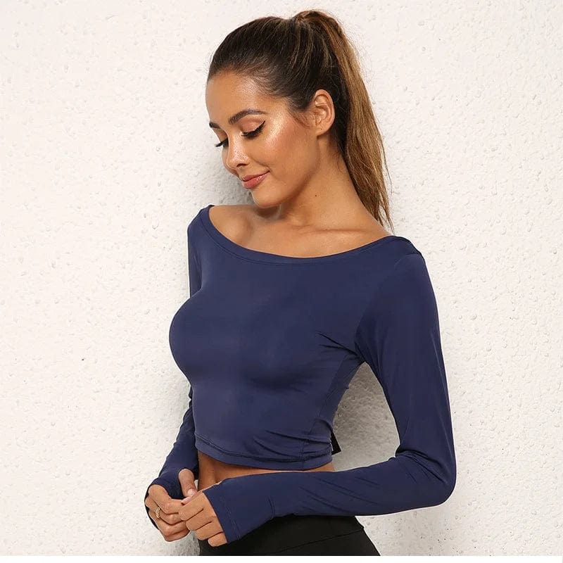 Damen Sporttop langarm, blau, figurbetont, ideal für Fitness und Yoga. Atmungsaktives Material, modisch und bequem für aktive Frauen.