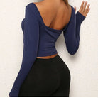 Damen Sporttop langarm, blau, figurbetont, Rückenfrei, ideal für Fitness und Yoga. Modisches Design, bequem und atmungsaktiv.
