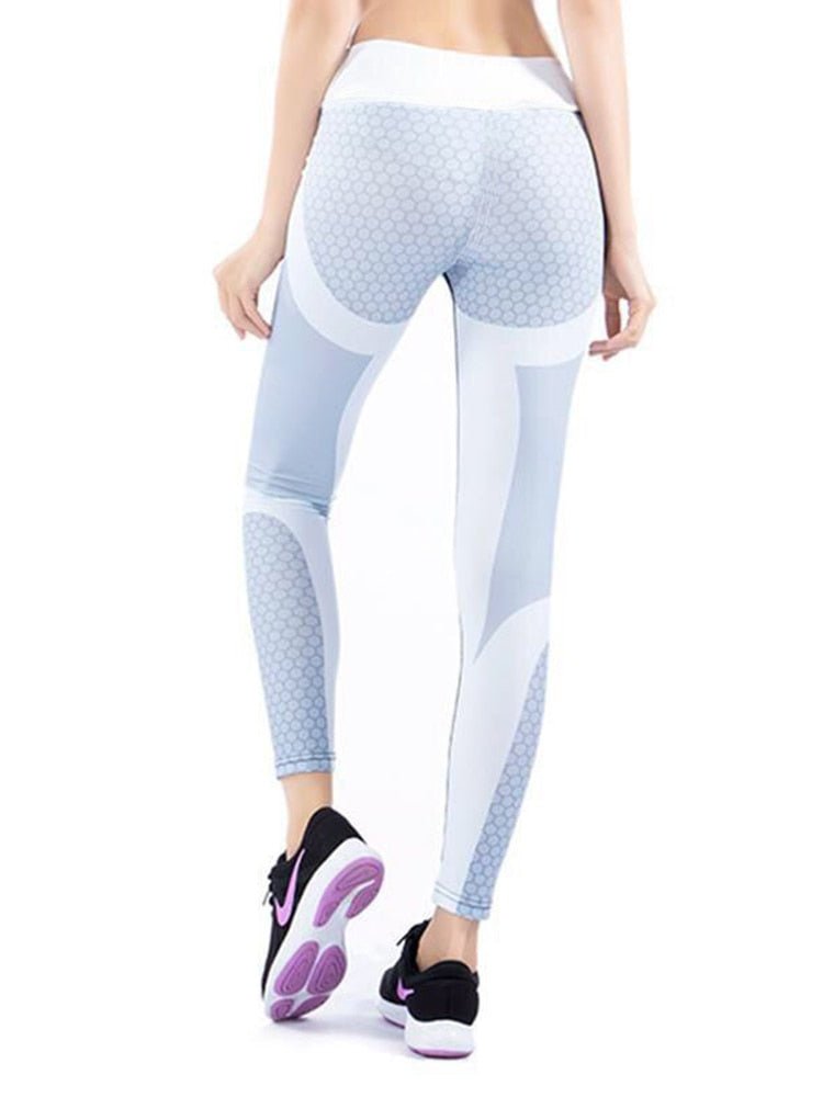 Sportliche Leggings in Weiß und Grau, ideal für Fitness und Yoga. Atmungsaktives Material, hoher Tragekomfort, modernes Design.