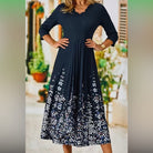Elegantes Damenkleid mit floralem Muster, knielang, in Dunkelblau. Perfekt für Sommermode, Freizeitkleidung und stilvolle Anlässe.