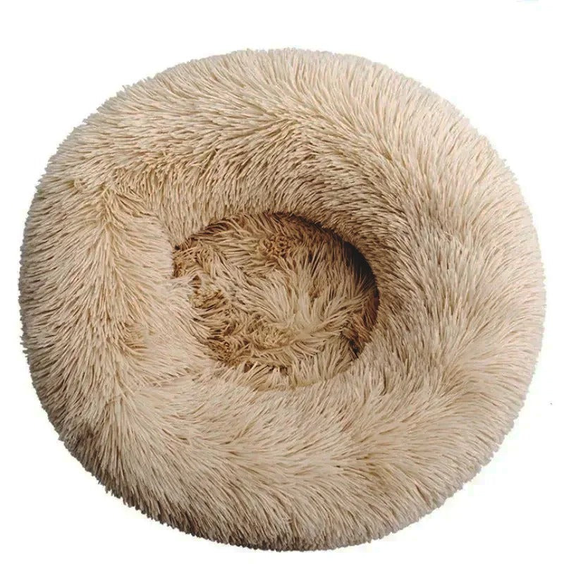 Rundes, flauschiges Hundebett in Beige, ideal für kleine bis mittelgroße Hunde. Komfortabel, waschbar, rutschfest. Perfekt für Haustierentspannung.