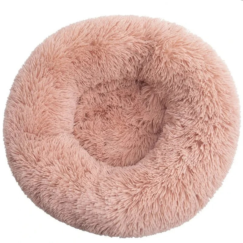 Rundes, flauschiges Haustierbett in Rosa, ideal für Katzen und kleine Hunde. Weiches Material, gemütlich und stilvoll für maximalen Komfort.