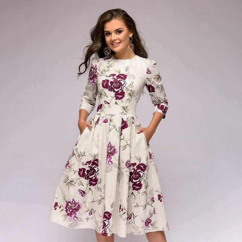 Elegantes, mittellanges Kleid mit floralen Mustern, ideal für besondere Anlässe. Hochwertige Verarbeitung, modisches Design, zeitloser Stil.