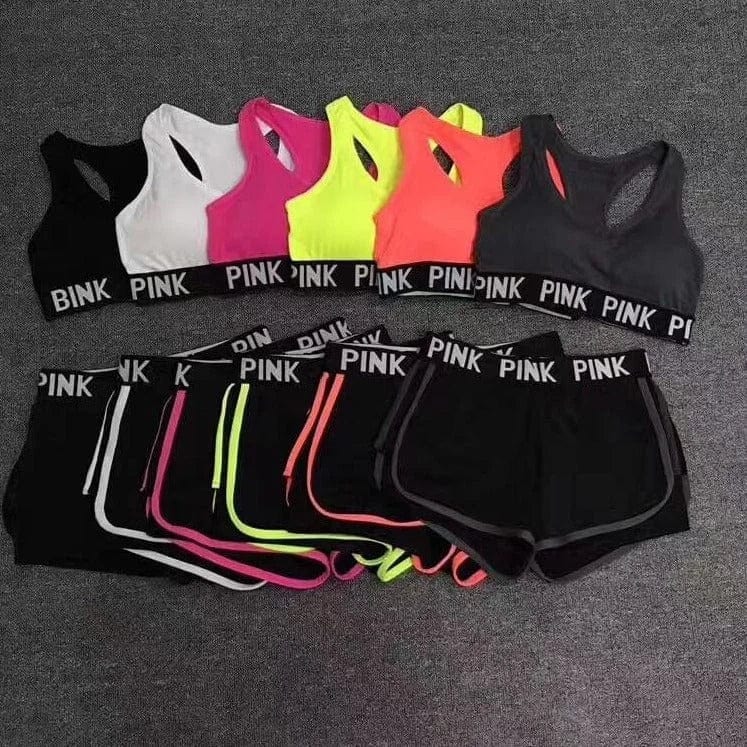 Damen Sportset in Rosa, Schwarz, Neonfarben. Bequeme Sport-BHs und Shorts mit "PINK" Logo. Perfekt für Fitness, Yoga, Laufen. Hochwertige Sportbekleidung.