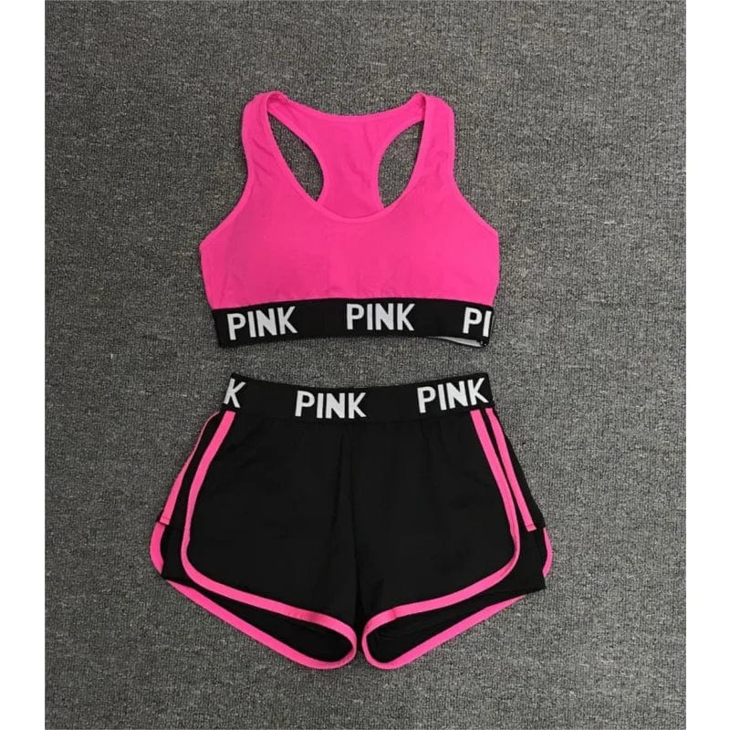 Rosa Sportset für Damen: Sport-BH und Shorts mit "PINK"-Aufdruck. Ideal für Fitness, Yoga und Laufen. Bequemes, atmungsaktives Material.