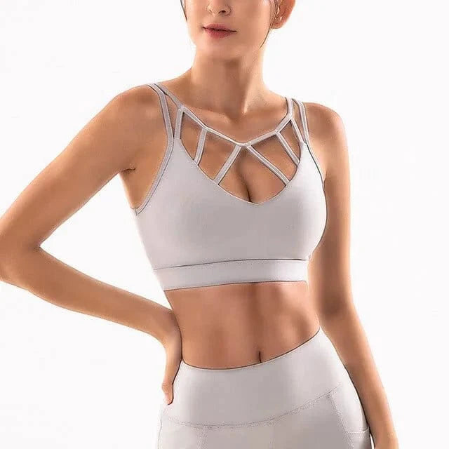 Grauer Sport-BH mit Zierfront, ideal für Fitness und Yoga. Atmungsaktives Material, modisches Design, perfekte Passform für aktive Frauen.