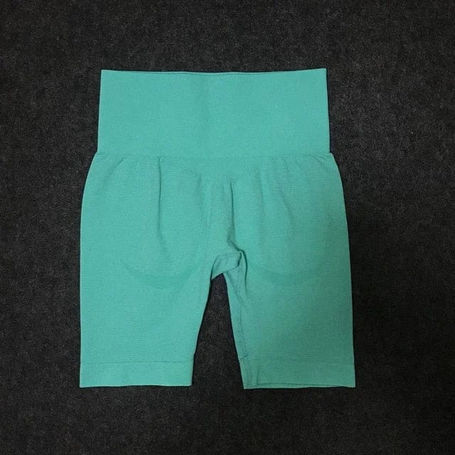 Damen-Radhose in Türkis, nahtloses Design, hoher Bund, ideal für Sport und Fitness. Bequeme Passform, atmungsaktives Material.
