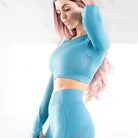 Damen-Longsleeve in Blau mit dekorativem Mesh, sportlich und figurbetont. Perfekt für Fitness und Yoga. Atmungsaktives Material.