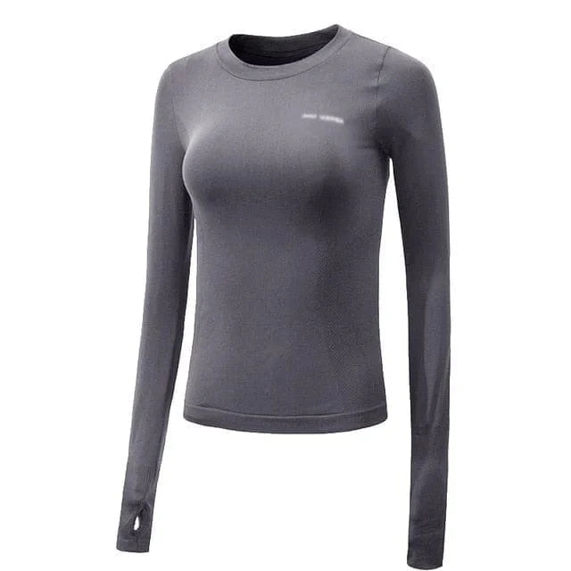 Graues sportliches Damen-Top mit Daumenausschnitt, langärmelig, atmungsaktiv, ideal für Fitness und Yoga. Hochwertige Sportbekleidung.