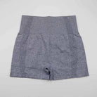 Graue Sportshorts mit hoher Taille, atmungsaktivem Material und nahtlosem Design. Ideal für Fitness, Yoga und Laufen. Größe S.