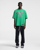 Grünes Oversize-T-Shirt mit "WASTED PARIS" Aufdruck, lässiger Streetwear-Stil, ideal für trendige Mode, Unisex, Baumwolle, urbaner Look.