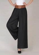 Schwarze Vintage-Hose mit hoher Taille und Schnürung, weiten Beinen, ideal für Retro-Mode-Liebhaber. Perfekt für stilvolle, bequeme Outfits.