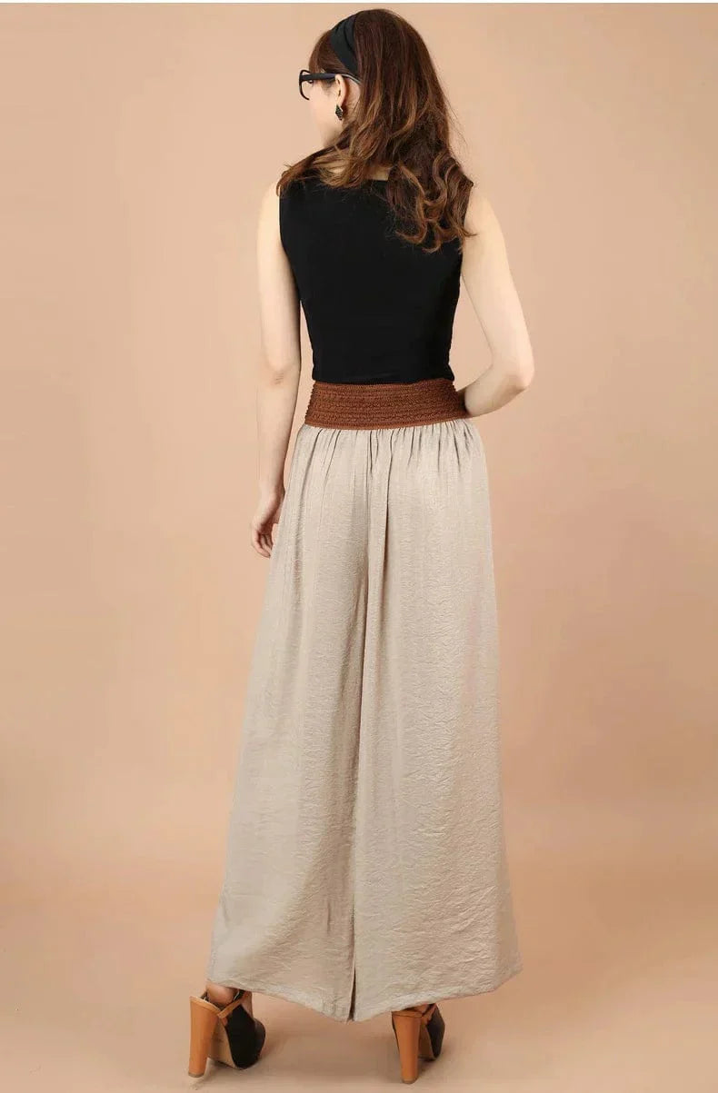 Damenhose mit hoher Taille und Schnürung, weite Vintage-Hosenbeine, beige, ideal für Retro-Mode und stilvolle Outfits.