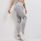 Damen Sportleggings in Grau, nahtlos, hohe Taille, ideal für Fitnessstudio und Yoga. Bequeme Passform, atmungsaktiv, modisches Design.